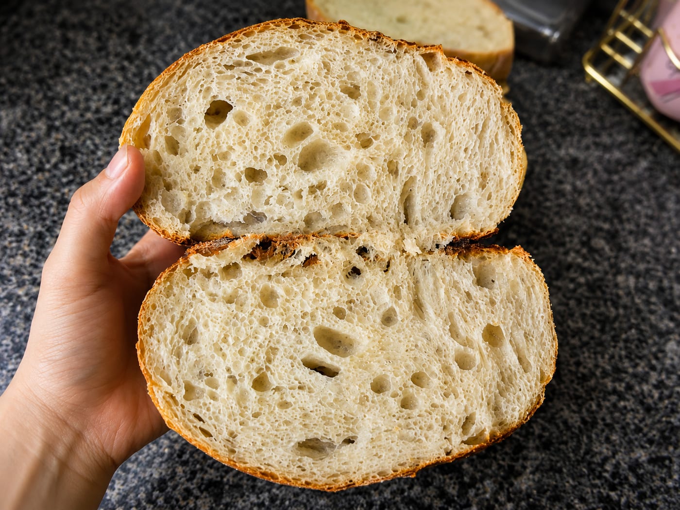 Freshly sliced sourdough bread showing the open crumb